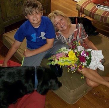 Helen Redwine with her son Owen and their pet dogs.